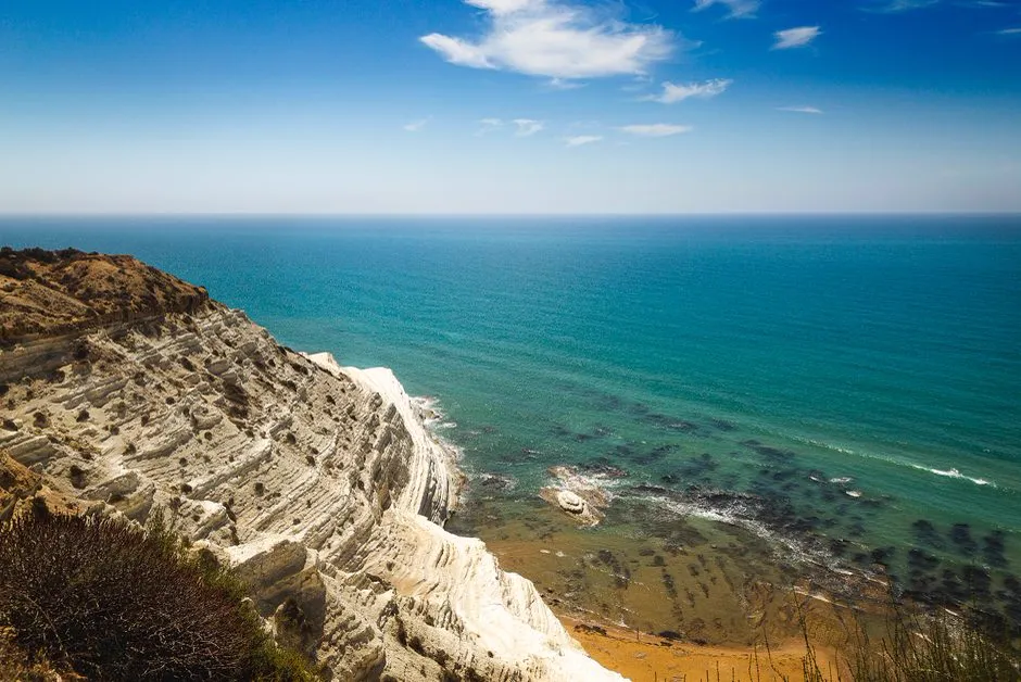 The white marl cliffs of Scala dei Turchi near Agrigento, Sicily, dropping into turquoise water