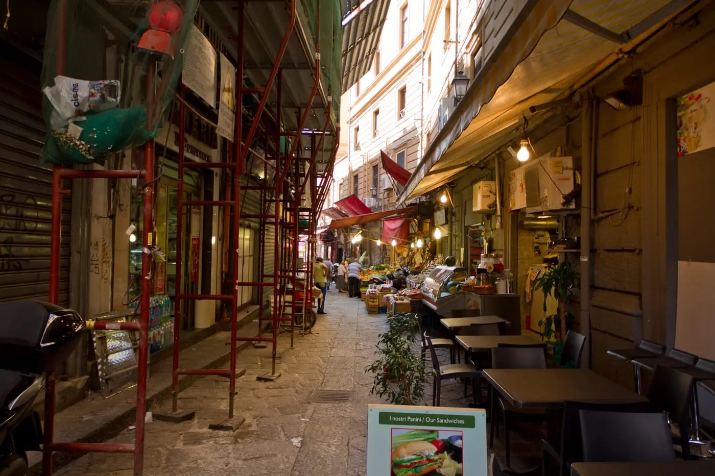 A lane in Palermo's Vucciria neighborhood lined with market stalls